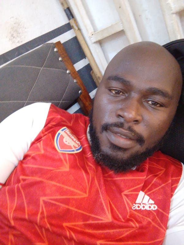 Indoor portraits captured of Arsenal fan and child with woman