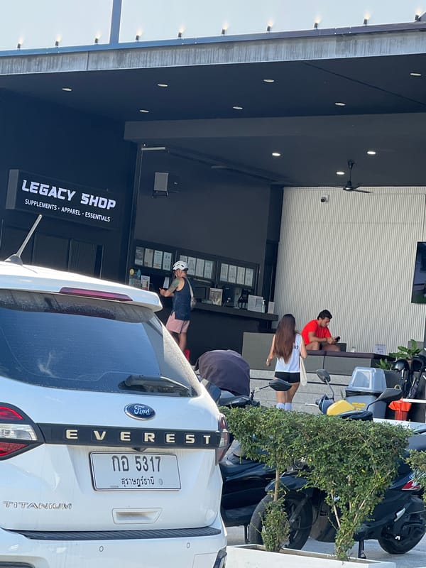 Woman approaches Legacy Shop in Choeng Mon, Thailand