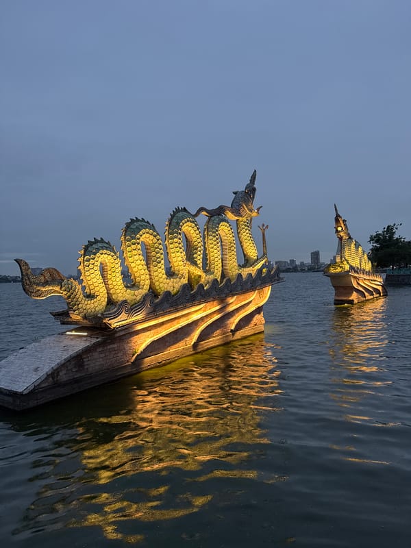 Hanoi's West Lake dragon sculptures glow at dusk