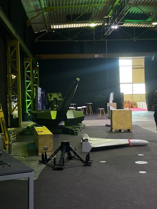 Military equipment exhibition displays anti-aircraft gun and missile