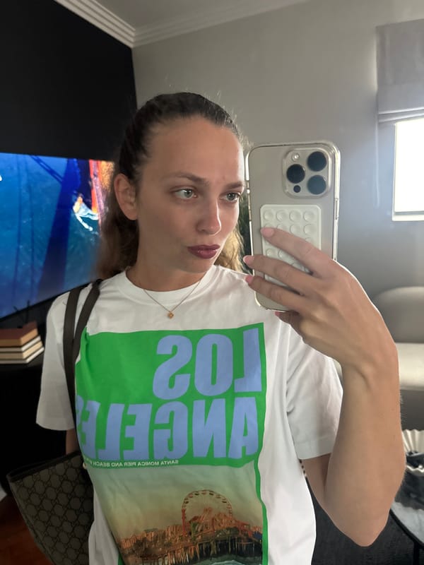 Woman takes selfie, Evergreen ship docked in Cape Town