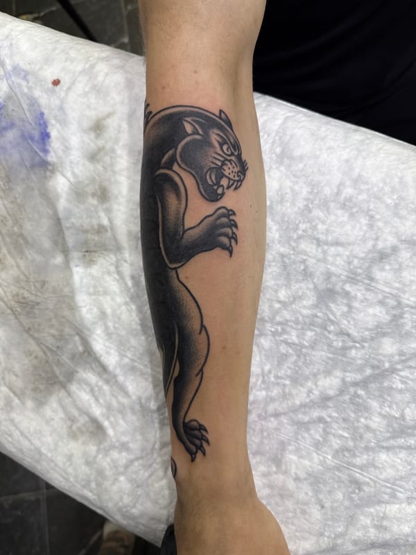 Black panther and gauntlet tattoos inked in Moscow