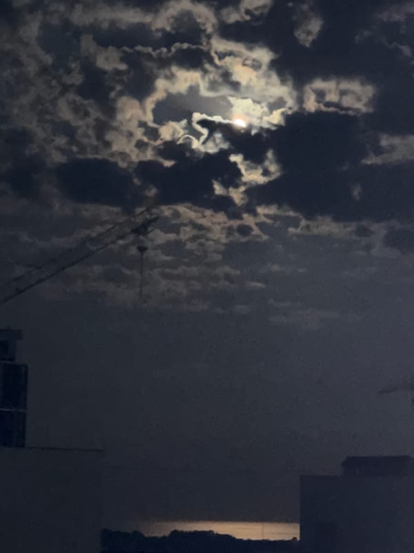 Full moon over Odesa on a cloudy summer night