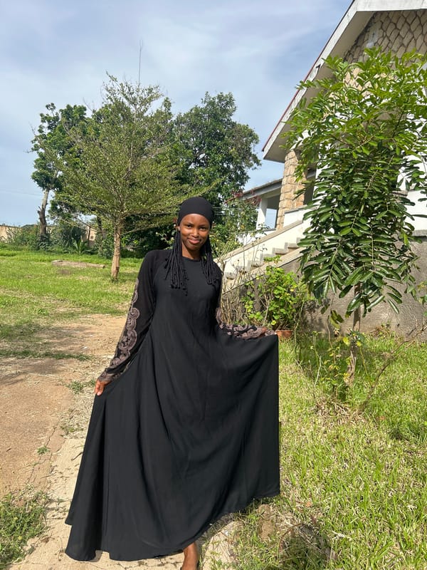 Posing outside a stone building in Vom, Nigeria