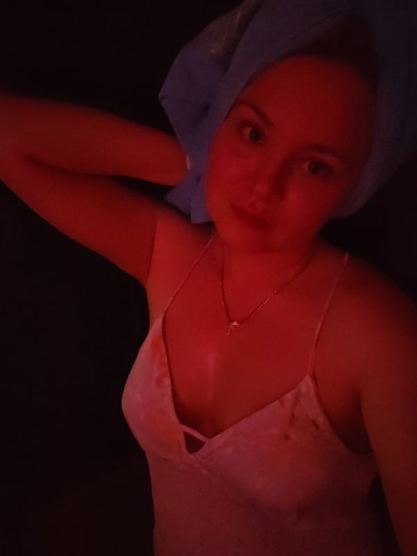 Woman photographed with peonies during evening session in Izhevsk