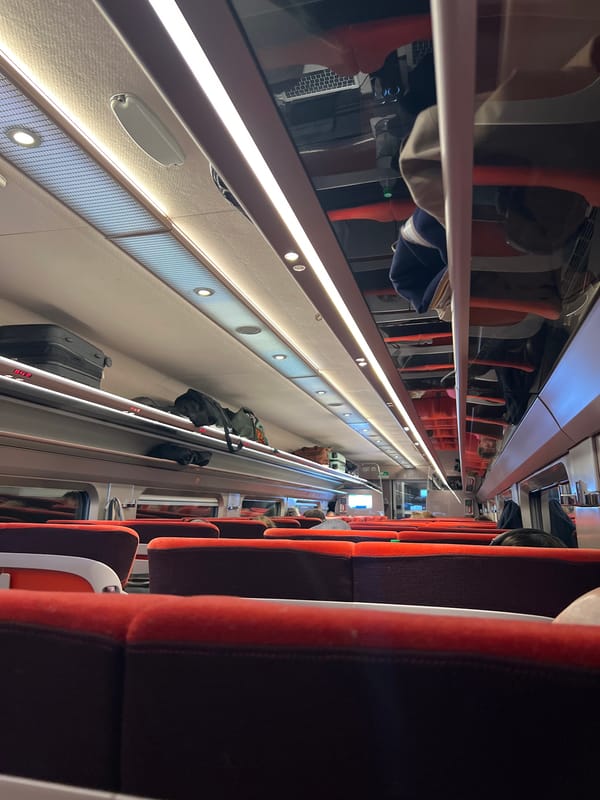 Train interior captured in Seclin showing passenger seating