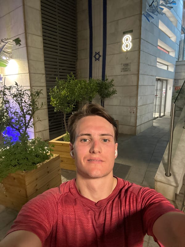 Man takes selfie near Israeli flag in Ramat Gan