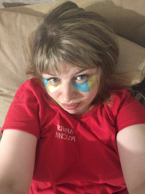 Woman in Russian shirt photographed with eye patches in Yaroslavl