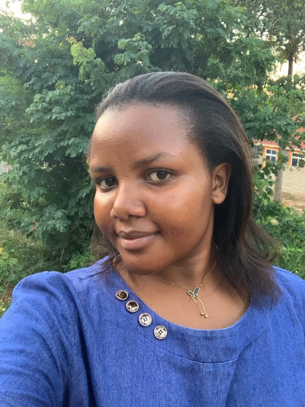 Woman in blue shirt spotted outdoors in Dar es Salaam