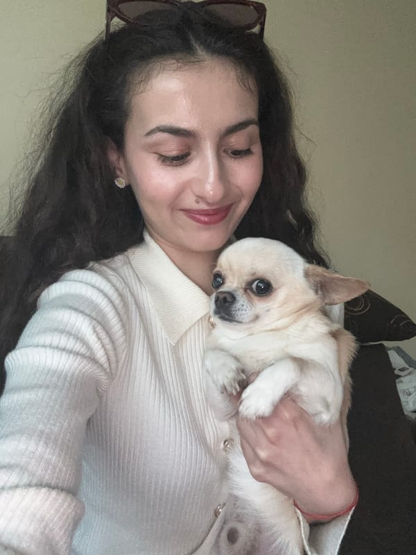 Woman holds chihuahua in Sofia, Bulgaria