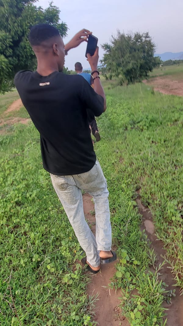 Walking the grounds of a rural Nigerian compound and surrounding landscape