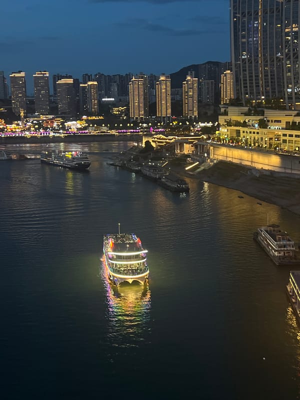 Chongqing's Yuzhong riverfront lights up at dusk