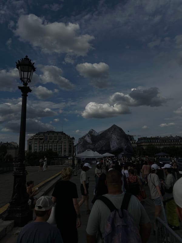 Paris afternoon: riverfront, wrapped bridge, and underground crowds