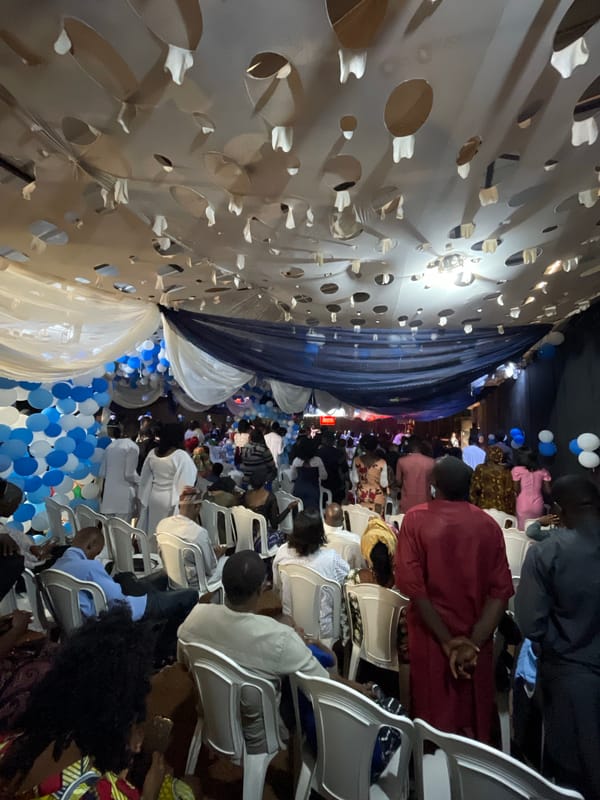 Indoor celebration with blue-white decorations across Nigerian venues