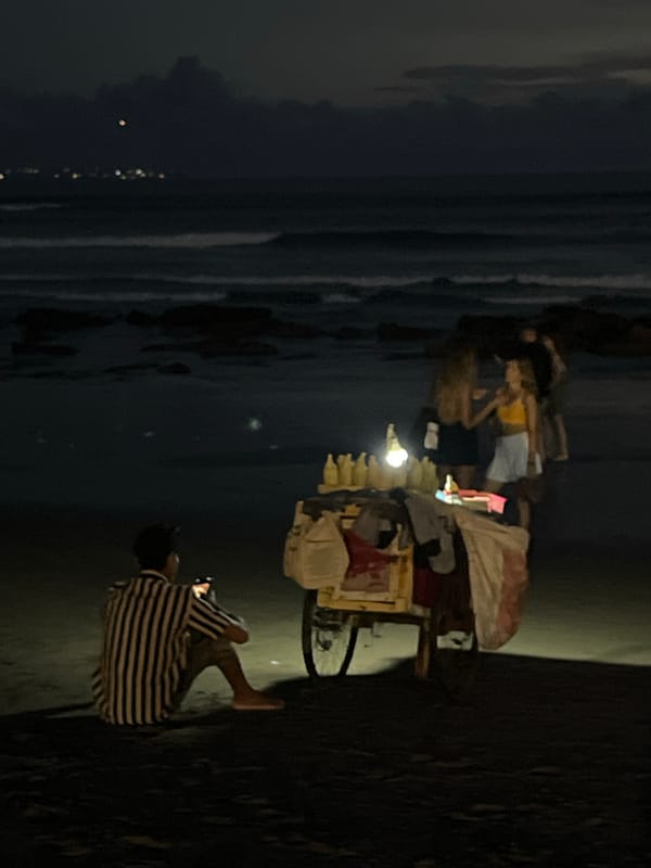Daily life captured at Canggu beach: vendors, temples, waste