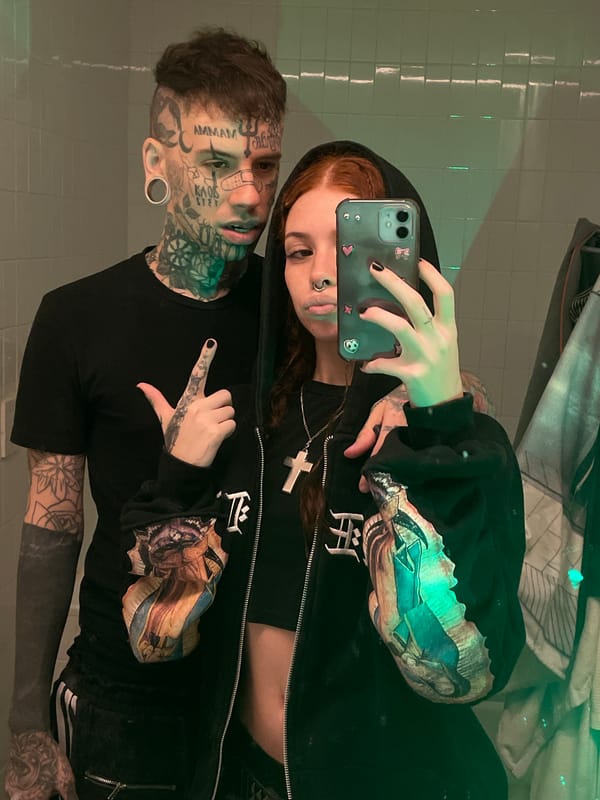 Tattooed couple takes bathroom selfies in Buenos Aires