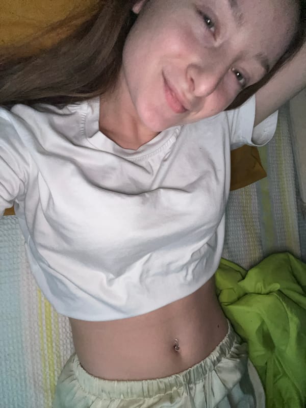 Woman rests on bed, makes kissing face in Varna
