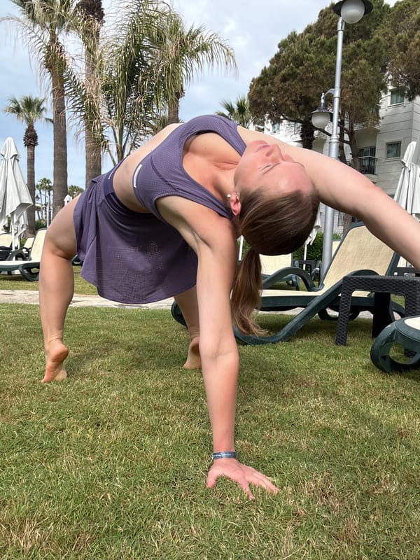 Morning yoga session at Turkish resort captured alongside tropical bird