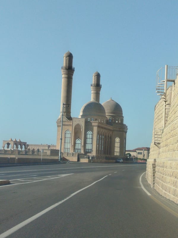 Heydar Aliyev Mosque stands under clear Baku skies