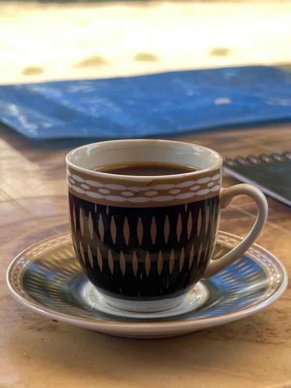 Coffee on a table, ruins in the background — everyday life in Gaza