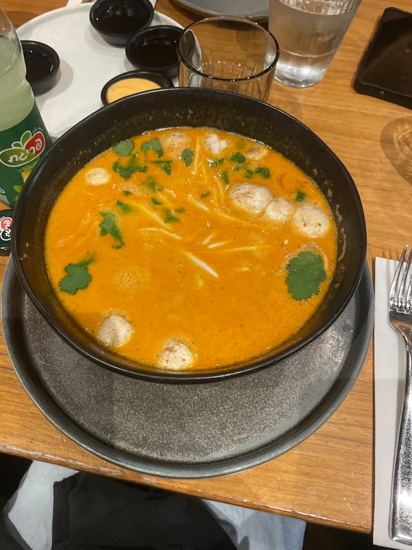 Couple documents Asian dinner experience in Raanana restaurant