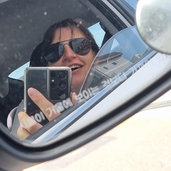 Side-mirror selfie from the driver's seat in Dunnae-myeon