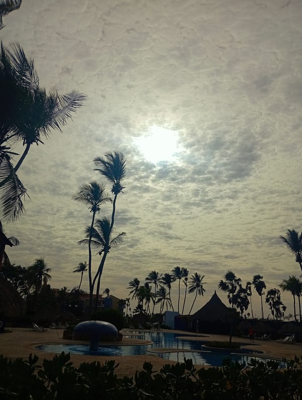 Young man documents leisurely afternoon at Venezuelan beach resort pool