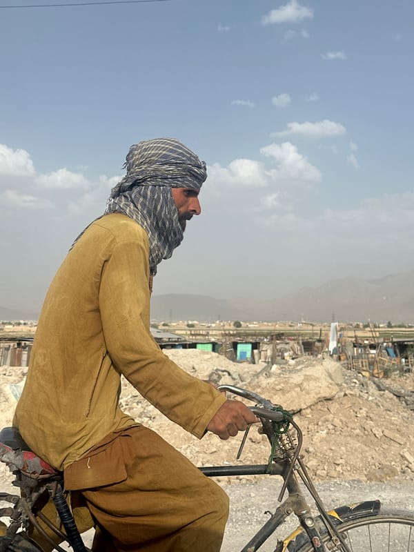 Cyclist in traditional dress spotted in Quetta, Pakistan