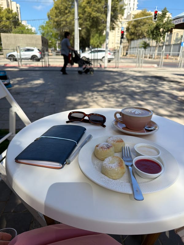 Morning breakfast captured at Bat Yam cafe with construction backdrop