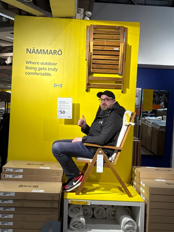 Shopper poses with thumbs-up in IKEA deck chair