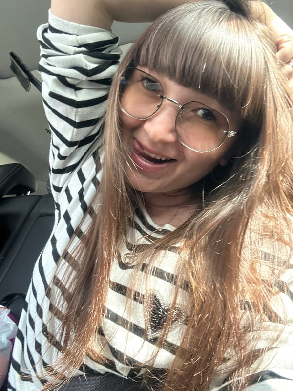 Woman takes selfies in car in Doksha, Russia
