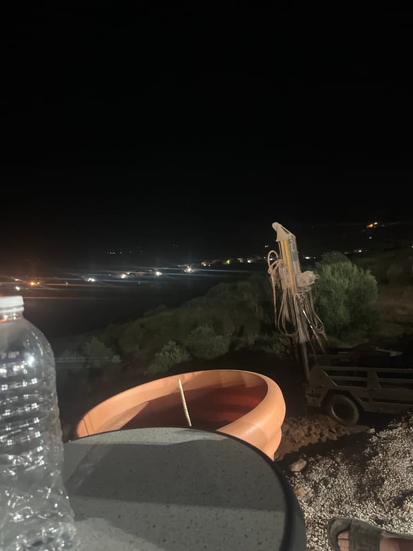Fuel truck delivers to illuminated gas station in Morocco