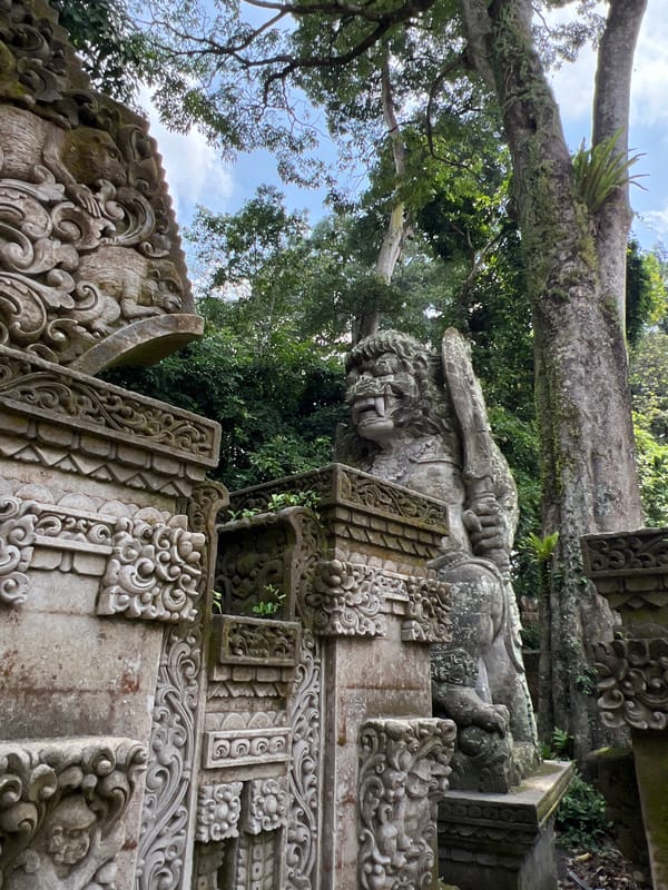 Casual moments captured in Ubud: motorcyclist, monkeys, parked Jeep