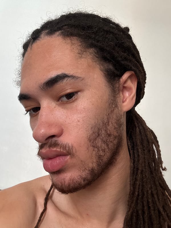 Close-up portrait with dreadlocks, shot twice in Paris
