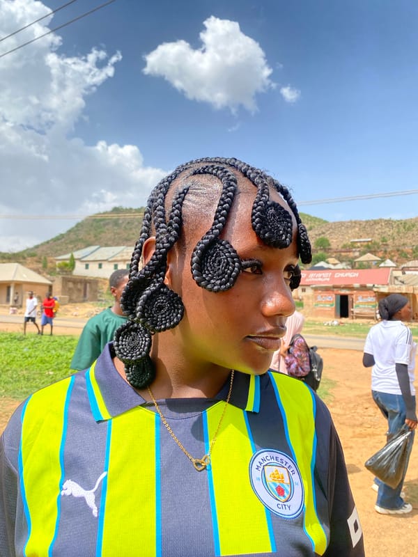 Woman in Manchester City jersey photographed in Gwong, Nigeria