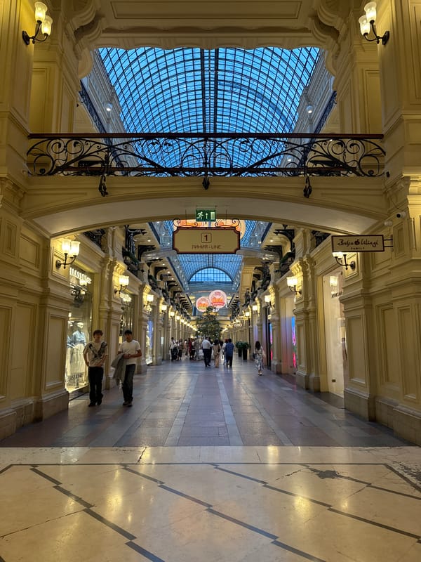 Inside GUM's grand glass-roofed arcade on Red Square