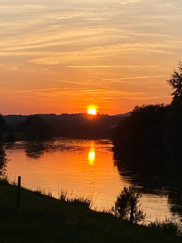 Golden sunset reflects off a river in Rinteln