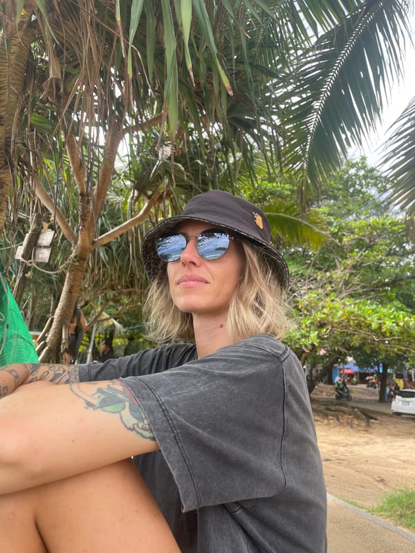 Lazy morning at a Rawai beach spot, surf rescue board nearby
