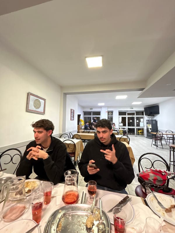 Young men dine together at Vila Real restaurant