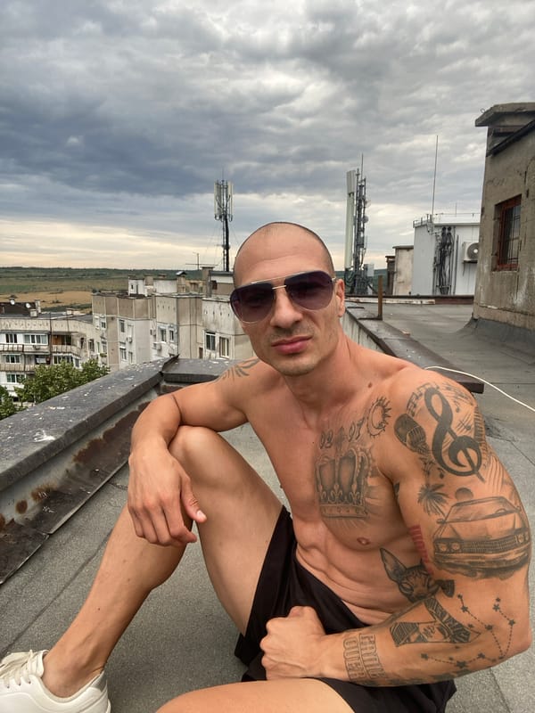 Tattooed rooftop session above Pleven's Soviet-era skyline