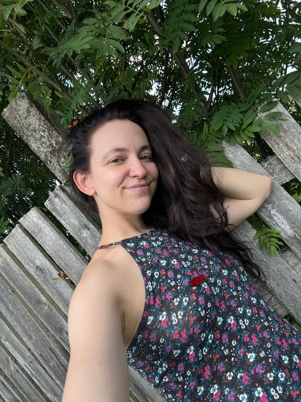 Lazy summer vibes: raspberries, a wooden fence, and a raft.