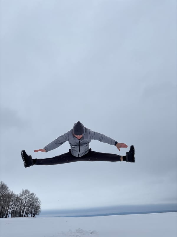 Man performs split pose in snow in Noviy, Russia