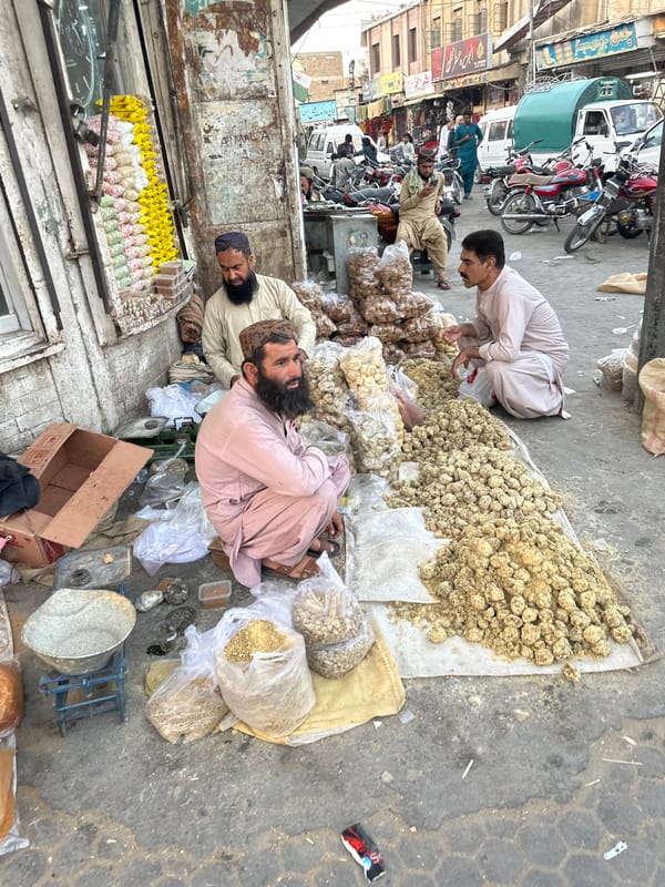 Street vendors selling dried goods and bread in Quetta market