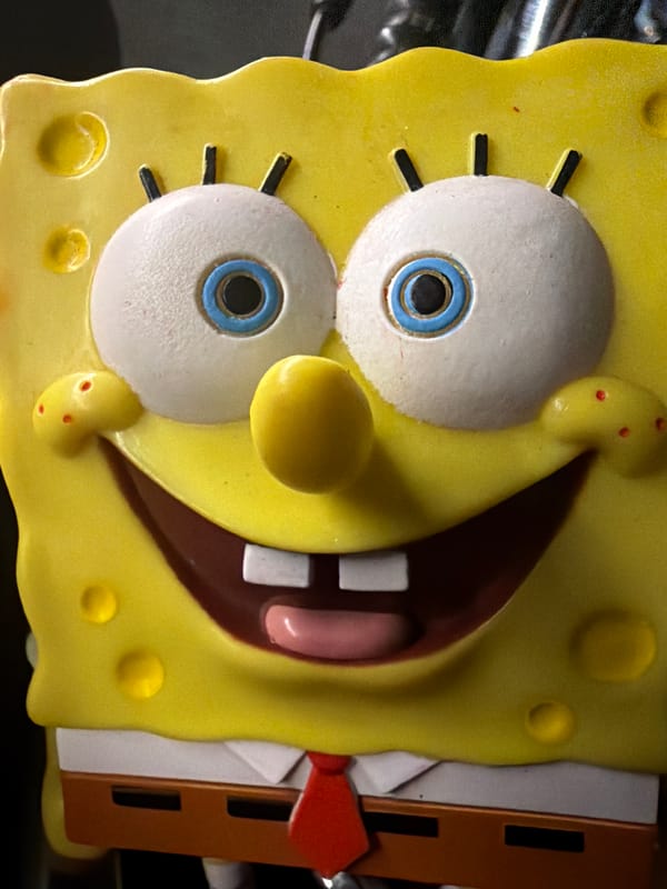 SpongeBob figurine posed and photographed on a motorcycle