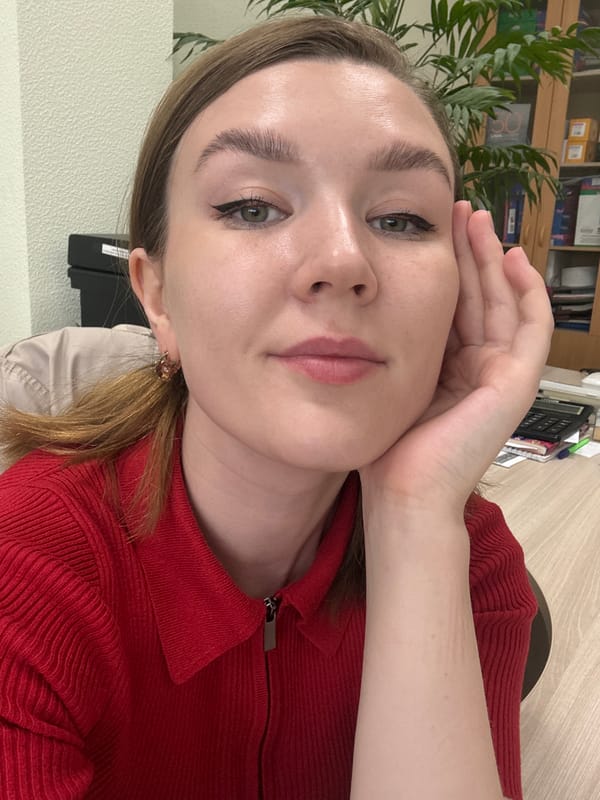 Woman in red shirt observed resting head in Izhevsk
