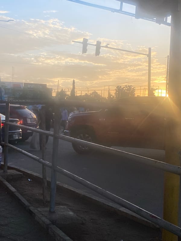 Sunset street life documented in Ikeja, Nigeria intersection