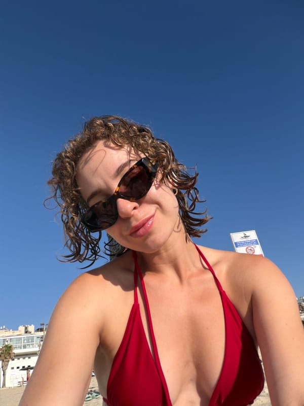 Sunny day at a Tel Aviv beach, blue sky overhead