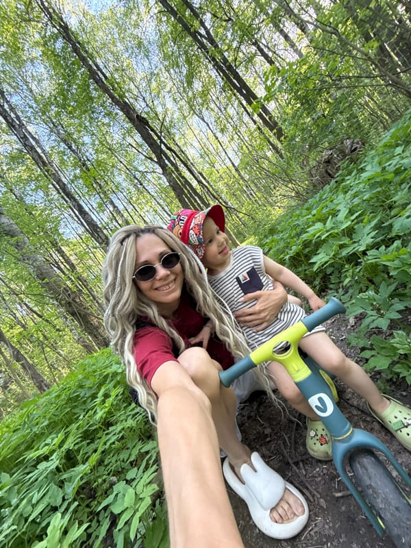 Mother and child enjoy spring afternoon in Russian woods