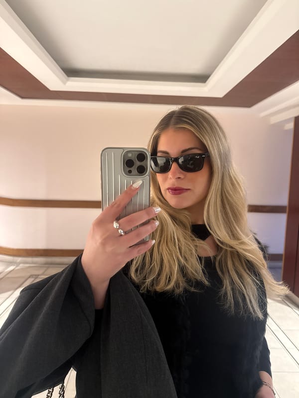 Woman takes mirror selfies in Paris bathroom