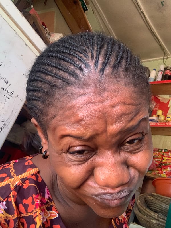Woman in traditional garment photographed indoors in Nigeria